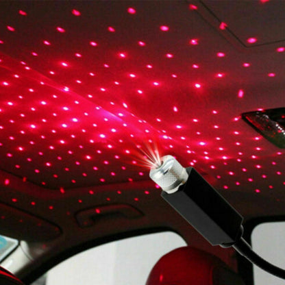 Car interior with starlight effect projected onto the ceiling using a red LED light projector.